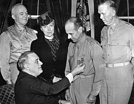 Army Chief of Staff George Marshall with Air Force Chief of Staff Gen. "Hap" Arnold accompanying Brig. Gen. James H. Doolittle while being presented the Medal of Honor from President Franklin Roosevelt for his achievement on leading the Doolittle Raid. 18 April 1942.