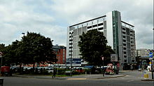 Photograph showing a multi-storey car park on the former site of Queens Hall.