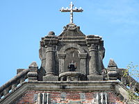 The cupola or roof lantern of the facade with the Cross