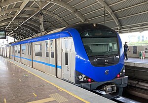 A metro train at Guindy station on the Blue Line