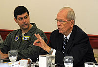 Retired General Larry Welch speaks at the Defense Science Board breakfast as Colonel Andrew Gebara, the 2nd Bomb Wing Commander, listens at Barksdale Air Force Base, on August 28, 2012.