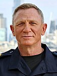 A picture of Daniel Craig smiling towards the camera