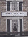 The official title of the house located between two windows on the front of the structure.