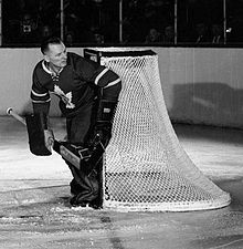 Johnny Bower protects the side of the post as a goaltender for the Maple Leafs.