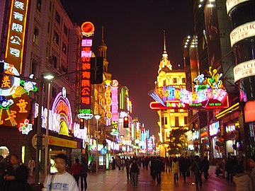 Neon lights in modern Shanghai with a predominance of red and yellow.