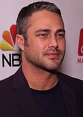 Taylor Kinney looking to the front.