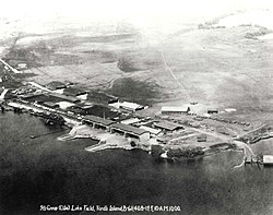 Aerial photo of shoreline buildings and docks