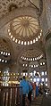 Interior of Sultan Ahmed Mosque ("Blue Mosque"), Istanbul. The main dome is surrounded by four semi-domes, three of which are visible in this image. They in turn have smaller semi-domes hanging off them.