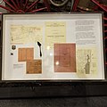 Close up of the display board of the display with documents about the fire