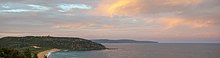 A photo of North Palm Beach and Barrenjoey Headland with Killcare Heights and Bouddi National Park on the Central Coast in the background