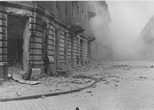 NARA copy #46, IPN copy #46 (No image caption, in section This is how the former Ghetto looks after having been destroyed) Ulica Kupiecka Street viewed from Zamenhofa, with Zamenhofa 42 / Kupiecka 18 on the left.