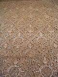 Sebka pattern filled with other motifs in carved stucco decoration at the Alhambra in Granada, Spain (14th century)
