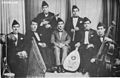 Image 13Iraqi music group led by Yusuf Za'arur in Baghdad, wearing the sidara, ca 1930. (from Music of Iraq)