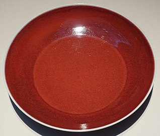 Dish with copper-red glaze, and a Xuande mark in cobalt oxide on the base. Ming dynasty, 1426-1435