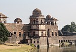 A building in Indo-Islamic style above a pond