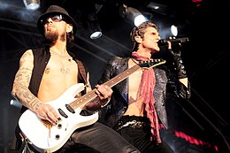 Dave Navarro and Perry Farrell performing in 2010