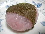 Dōmyōji consists of a sweet pink mochi and red bean paste, covered with a cherry blossom leaf.