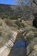 Concrete-lined portion of La Canova acequia, near Velarde, New Mexico