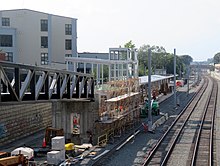Construction of a railway station in a wide cut