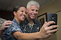 ABU DHABI Air Traffic Controller 2nd Class Samantha Kelly, left, takes a “selfie” with Capt. Karl Thomas, commanding officer of aircraft carrier USS Carl Vinson, in the ship’s in-port cabin on 25 February 2015. Carl Vinson is deployed in the U.S. 5th Fleet area of operations supporting Operation Inherent Resolve, strike operations in Iraq and Syria as directed, maritime security operations, and theater security cooperation efforts in the region.