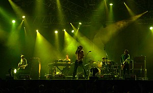 The Tears performing at Roskilde Festival in Denmark in 2005 (L–R: Nathan Fisher, Will Foster, Brett Anderson, Makoto Sakamoto, Bernard Butler).