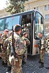 Boarding of buses by the battalion