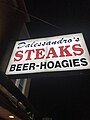 Dalessandro's Steaks sign photographed at night