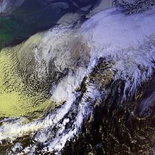 Two cyclones over the northern Atlantic Ocean, connected by a line of clouds