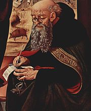 Painting of Saint Anthony with a pig in background by Piero di Cosimo c. 1480