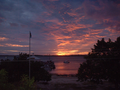 Sunset over Government Dock and harbour, Harbour Island Bahamas, looking West from Dunmore School