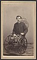 Amputee in a 19th-century wheelchair