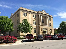 Image of Old court house with cars parked outside