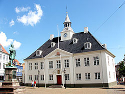 The old Town Hall on the square in Randers with statue of Niels Ebbesen in front