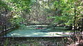 The old swimming pool has been filled in and there is gravel rock on top.