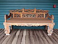 Wooden bench on covered porch