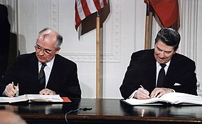 American president Ronald Reagan and Soviet leader Mikhail Gorbachev ease tensions between the two superpowers, leading to the end of the Cold War