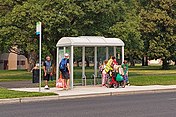 People waiting at a bus stop