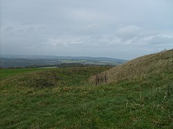 Rampart, ditch and bank of the Trundle Iron Age hillfort