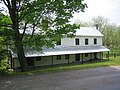 The Hiett Log House along Cold Stream Road (County Route 45/20) in North River Mills