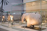 A large ancient stone carving, dating back to 8100 BC, of an equid—an animal belonging to the horse family, found at Al-Magar. The piece itself, measuring 86 cms long by 18 cms thick and weighing more than 135kg., is a large sculptural fragment that appears to show the head, muzzle, shoulder and withers of a horse.[8]