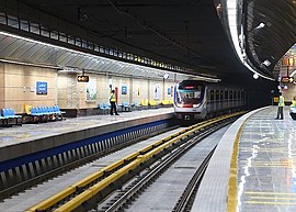 Top: Outside view of Imam Khomeini station Bottom: A train at the Ghoddoosi Metro Station