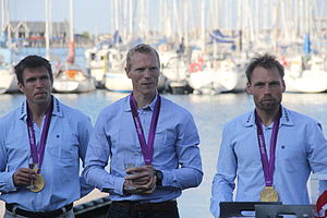 Three men with their Olympic medals