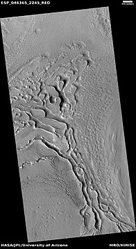 Wide view of terrain caused by ice leaving the ground, as seen by HiRISE under HiWish program