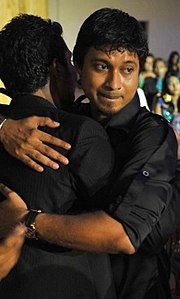 Yoosuf Shafeeu hugging a friend