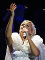 Helene Fischer has a migrant background despite being ethnically German because she was born in the Soviet Union to parents of the German minority in Russia.