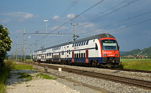 Red-white-and-blue double-decker train