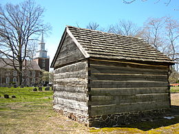 Mortonson-Van Leer Log Cabin, ca. 1700, with the cemetery in between the cabin and church