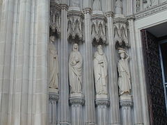 Detail of figures flanking south doors