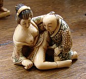 Erotic Japanese ivory with black, green and red ink