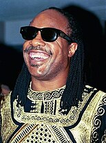 Picture of a Stevie Wonder with dreadlocks smiling